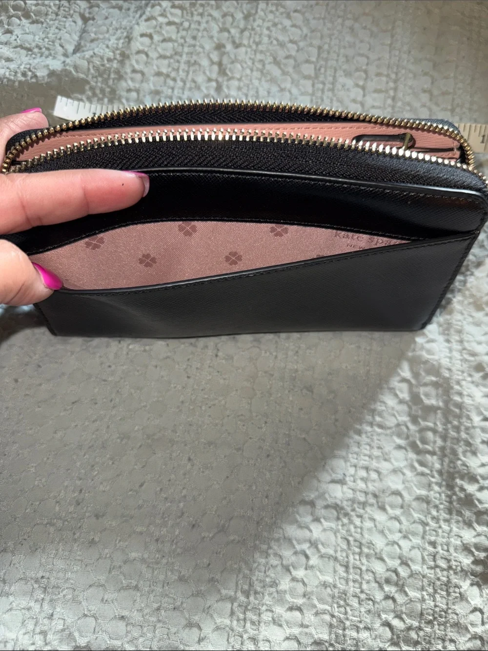 kate spade black zip-around Saffiano leather wallet with gold logo